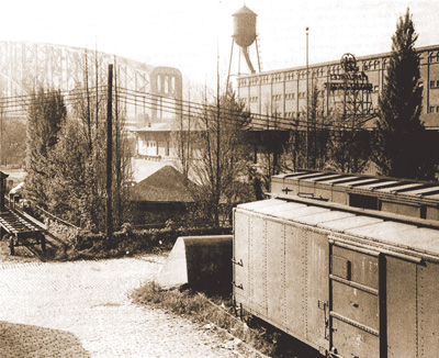 Fort Pitt Blockhouse with the Pennsylvania Railroad  Warehouse and Freight Station, late 1940s (image: Historic Pittsburgh).